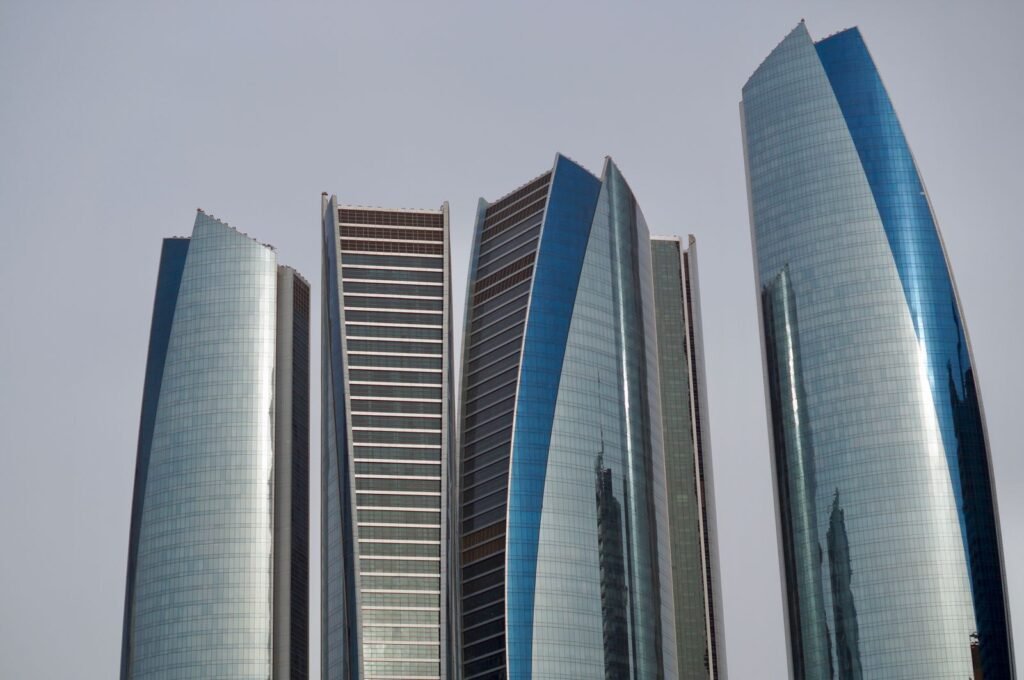 The five curved glass towers of Etihad Towers, a landmark for anyone buying property in Abu Dhabi.