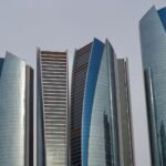 The five curved glass towers of Etihad Towers, a landmark for anyone buying property in Abu Dhabi.