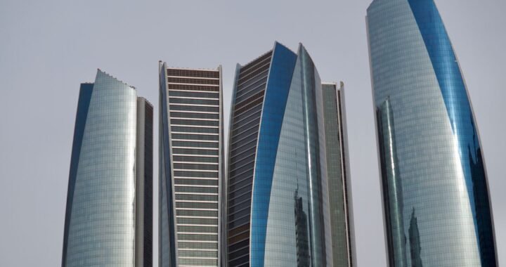 The five curved glass towers of Etihad Towers, a landmark for anyone buying property in Abu Dhabi.